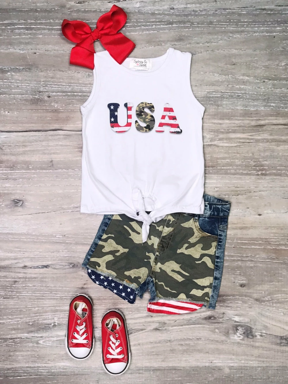 Sydney So Sweet New Arrivals USA Camo American Flag Tie Knot Denim Girls 4th Of July Shorts Outfit 1 Sydney So Sweet New Arrivals USA Camo American Flag Tie Knot Denim Girls 4th Of July Shorts Outfit